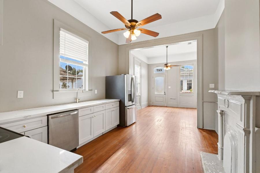 Kitchen and dining area looking toward the front of the apartment