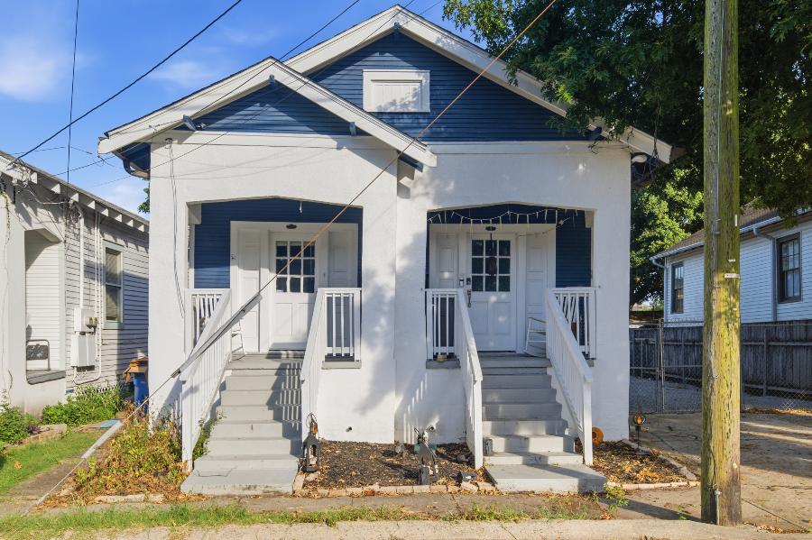 1708 S. Lopez Street, a navy and white double with covered front porches in Broadmoor, New Orleans