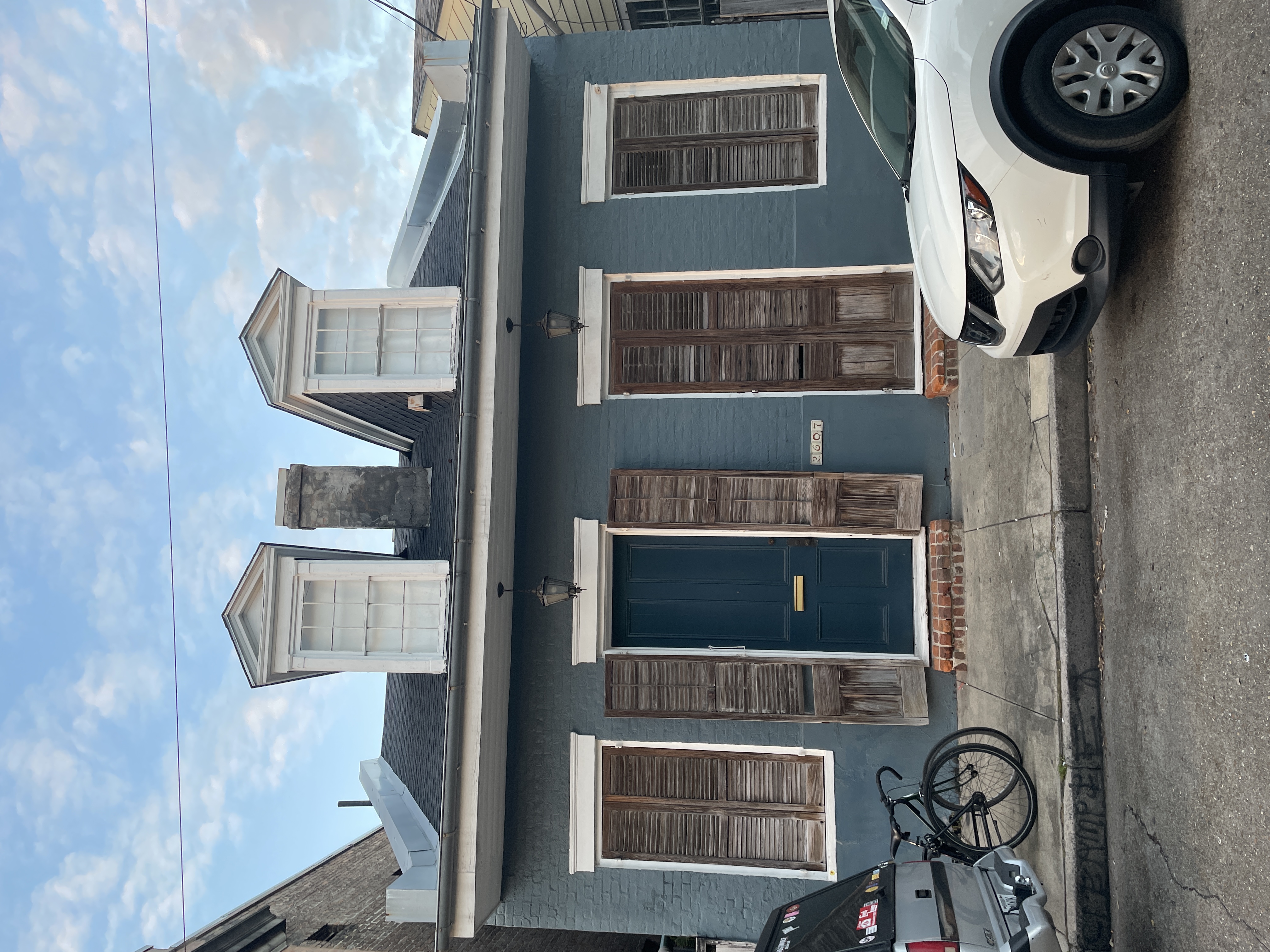 Pink Creole cottage with hand-painted bee and flower murals in the Bywater, New Orleans
