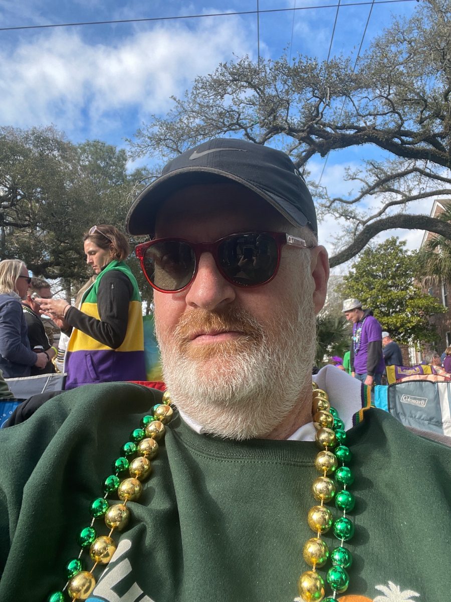 Cameron Smith wearing beads at a Mardi Gras parade in New Orleans